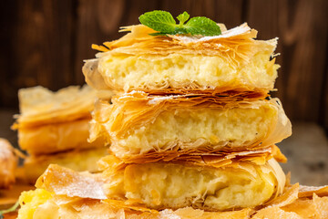 Sweet filo pastry with cream filling. Close-up.