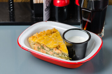 American salmon pie with spinach, mozzarella and sour cream dip