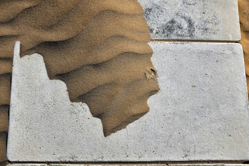 sand on boardwalk