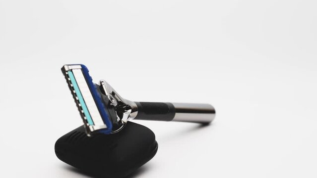 Modern men's razor with a lot of blades on a white background. Gift for the modern man. Body and beard care. Blitz machine.