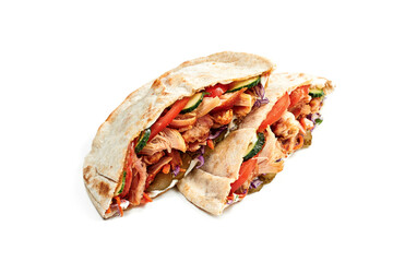 Pita sandwich with shawarma meat (chicken), tomatoes and cucumbers isolated on white background