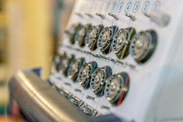 Elements and mechanisms of sewing equipment close-up. Soft focus