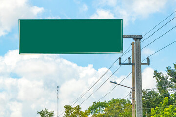 Directional green blank empty road sign in Tulum Mexico.