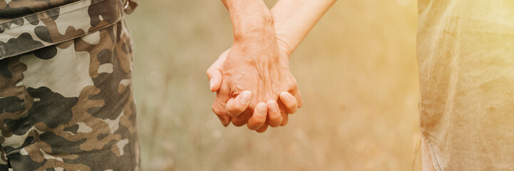 happy senior couple holding hands. hands of man and woman hold each other. romance and love and...