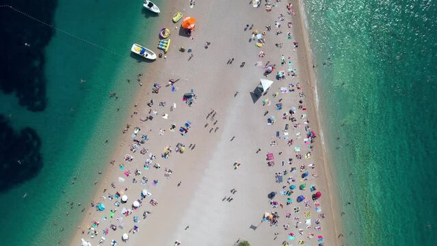 Top Down Pan Along Vibrant Pristine Golden Horn Beach Peninsula Summer Day Adriatic Sea Zlatni Rat Brac Island Croatia Drone 4k