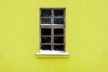 Green wall and old wooden window