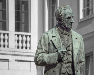 Bronze portrait of Alessandro Manzoni in San Fedele Square.Milan, Italy.