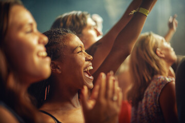 Fototapeta Having the time of their lives. Young girls in an audience enjoying their favourite bands performance. obraz