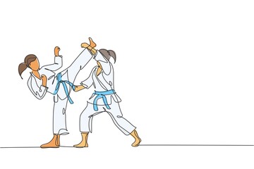 One continuous line drawing of two young talented karateka girls train pose for duel fighting at dojo gym center. Mastery martial art sport concept. Dynamic single line draw design vector illustration