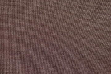 Fototapeta na wymiar Flat brown-colored fabric texture background. This fabric is made of cotton and polyester.