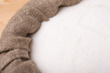 Sack of white sugar. High-quality sugar made of beets in linen sack