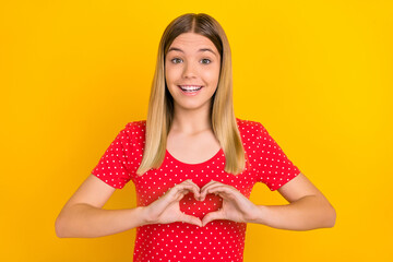 Photo of young cheerful lady show hands heart shape cardiac cupid valentine day isolated over yellow color background