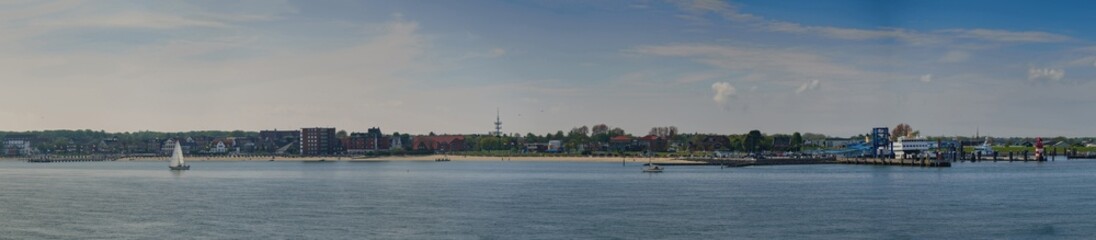  Panoramic view of the coastal landscape with the beach and port of Wyk auf Föhr from a ferry....
