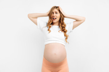 frightened unsure pregnant woman standing . Nervous excited woman experiences before childbirth Human emotions