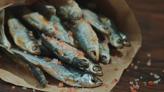 Lots of sun dried fish in the paper bag.