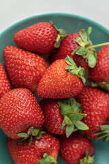 Ripe red strawberries on a plate