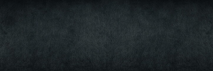 Black shale wide panoramic texture. Dark grey gloomy grunge abstract widescreen banner background