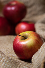 Apples with low depth of field. Red apples on burlap