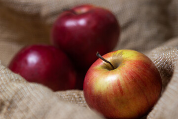 Apples with low depth of field. Red apples on burlap