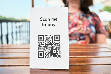 QR code for contactless payment in a restaurant. Concept of cashless technology.