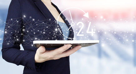 24 7 all day all night. Technical Support Center Customer Service Business Concept. Hand hold white tablet with digital hologram 24 7 all day all night sign on light blurred background.