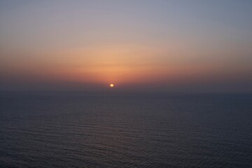 Amazing orange sunset and view of the Aegean Sea in Santorini Greece