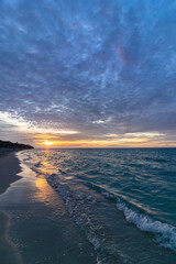 Beautiful sunset on the ocean shore in the evening