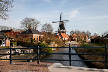 The old mill with the name 'Dutch prosperity' right next to the famous hiking trail with the name 'Pieterpad' in the beautiful village of Mensingeweer, province of Groningen, the Netherlands
