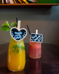 Homemade fresh lemonade on wooden table and gray background. 