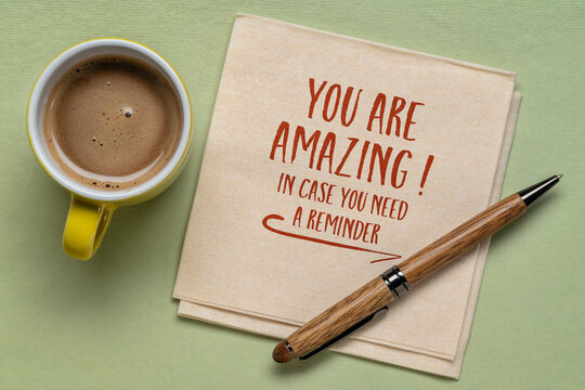 You are amazing, in case you need a reminder - inspirational note or positive affirmation, handwriting on a napkin with coffee, personal development concept