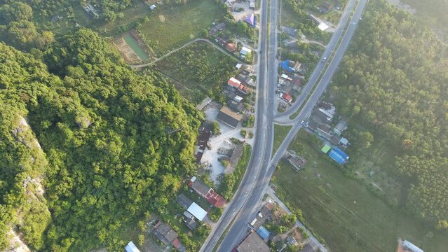 aerial view of road and home,beautiful nature in the morning,shot from top view,still flying on one place