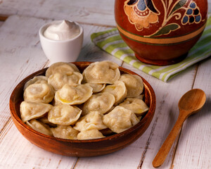dumplings in clay plate on wooden background for restaurant menu5