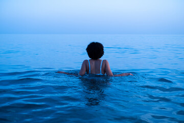 woman swimming in bikini