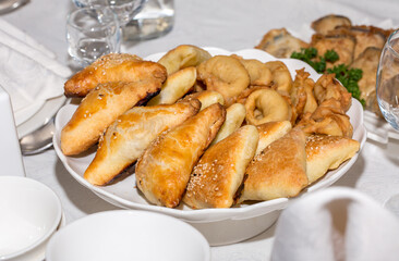 Samsa Uzbek triangular close-up. Traditional folk dish made of dough and meat. Kazakhstan and Uzbekistan culinary traditions and customs.