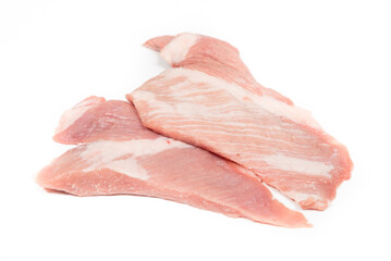 Some pieces of iberic secret pork extra of bellota in a white background