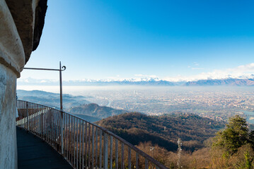 Aerial view of the city of Torino (Turin) with italian alps mountain range, Piedmont, Italy. View from the roof of the beautiful Basilica di Superga (Superga's Cathedral).