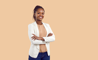 Studio portrait of happy successful confident black business woman. Beautiful young lady in white...
