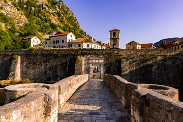 Fototapeta premium Entrance to old town of Kotor over bridge with fortress
