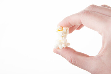 image of pop corn hand white background