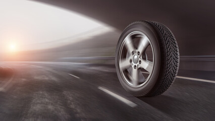 Sport car tires on a road - safety and good grip at speed. - obrazy, fototapety, plakaty