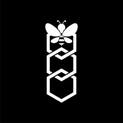 Bee and honeycomb icon isolated on dark background