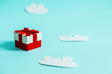 Gift box and paper clouds.