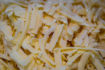 Looking down at a pile of grated cheese