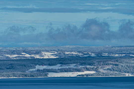 Cultural landscape of Hedmark, Innlandet, by Lake Mjøsa, Norway, in winter.