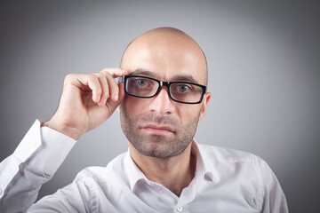 Caucasian young businessman wearing eyeglasses.