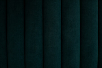 Background green velour textile, suede velvet sofa. Soft stripes backdrop, couch seat. Macro...