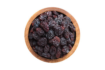 dried grapes, dark raisins in wooden bowl isolated on white background. Vegan food, top view.