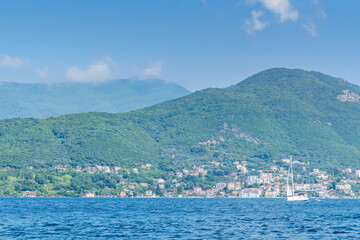 Scenic panoramic landscape view on Bay of Kotor, Montenegro with mountains at sundown. - 487396122