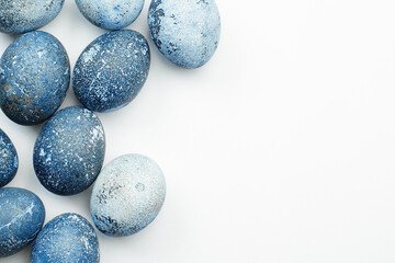 blue easter eggs on a light background
