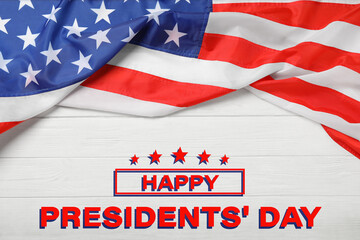 Fototapeta na wymiar Happy President's Day - federal holiday. American flag and text on white woooden background, top view
